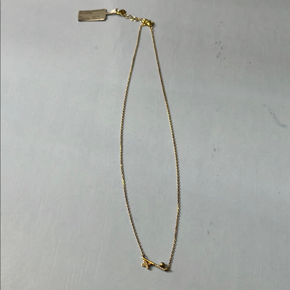 Elegant Gold plated necklace with cz x and bar